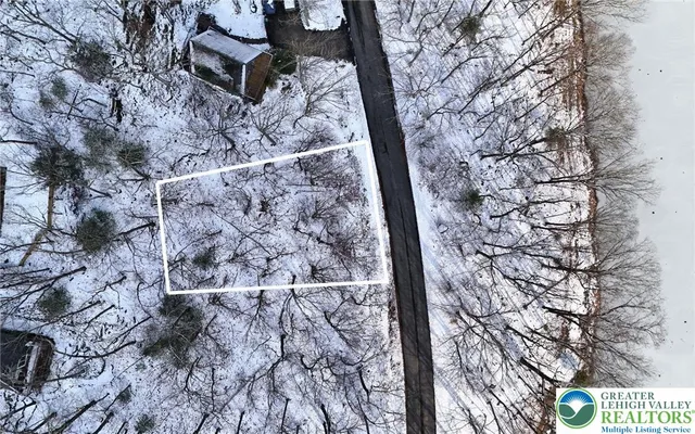 a view of snow on the side of a road