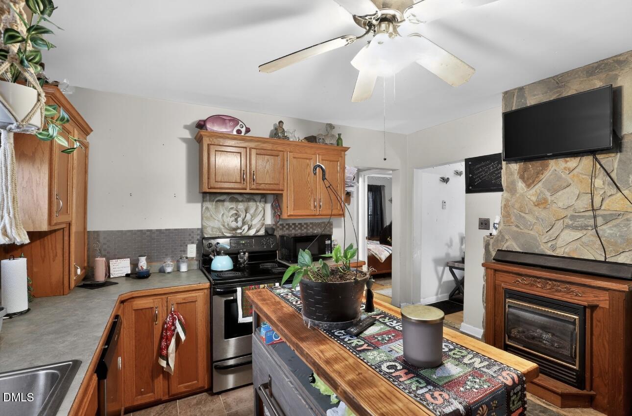 860 Virginia Road Marion, NC 28752 - Photo 13 of 23 a living room with fireplace furniture and a flat screen tv
