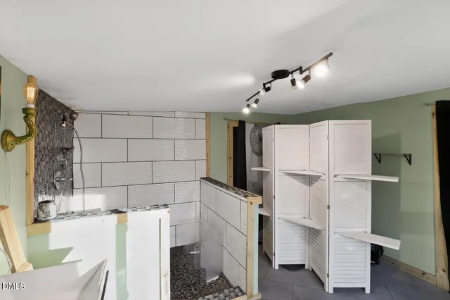 a kitchen with a refrigerator and countertop