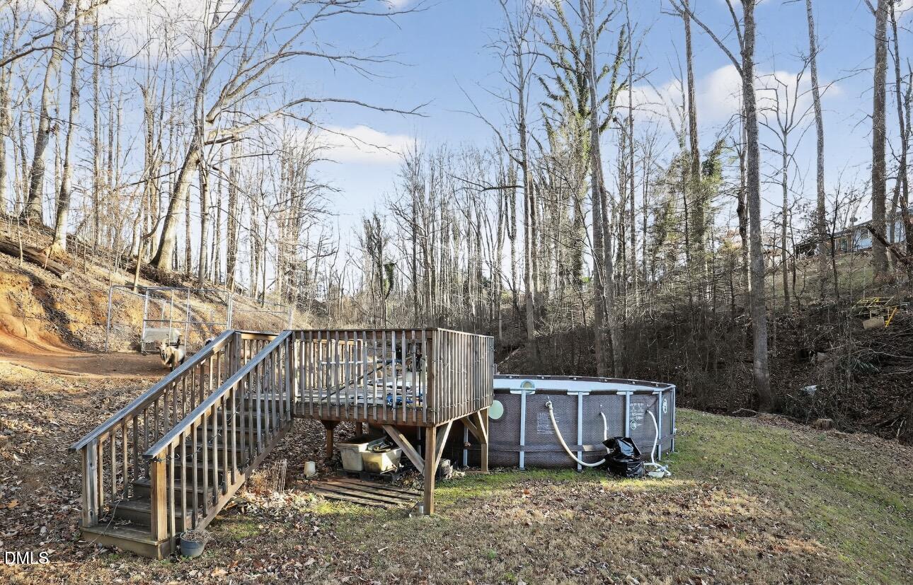 860 Virginia Road Marion, NC 28752 - Photo 3 of 23 a view of a roof deck with wooden fence and a bench