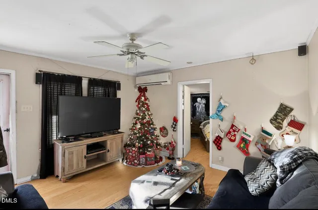 a living room with furniture and a flat screen tv