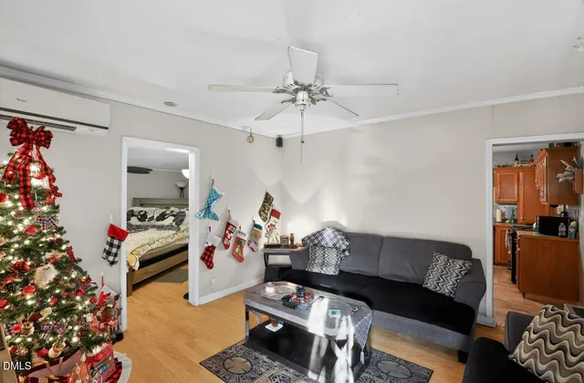 a living room with furniture and flowers