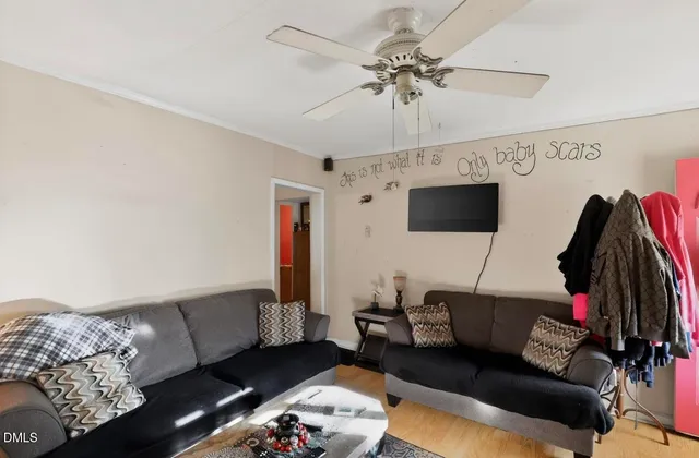 a living room with furniture and a flat screen tv