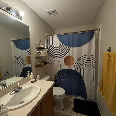 a bedroom with bed and window