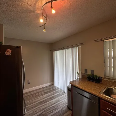 a room with a window and a sink