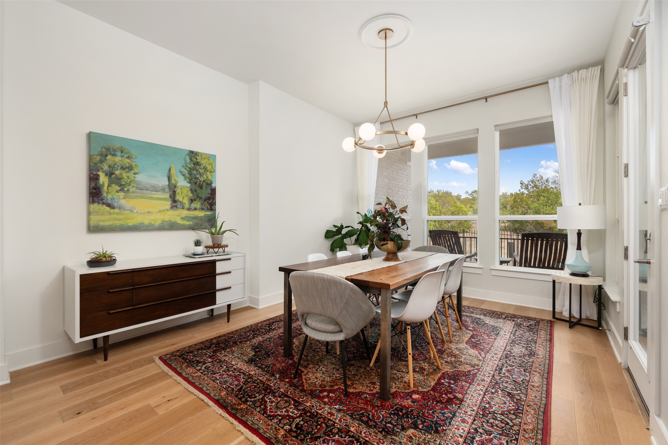 438 Pear Tree Lane Austin, TX 78737 - Photo 11 of 40 a view of a dining room with furniture window and wooden floor