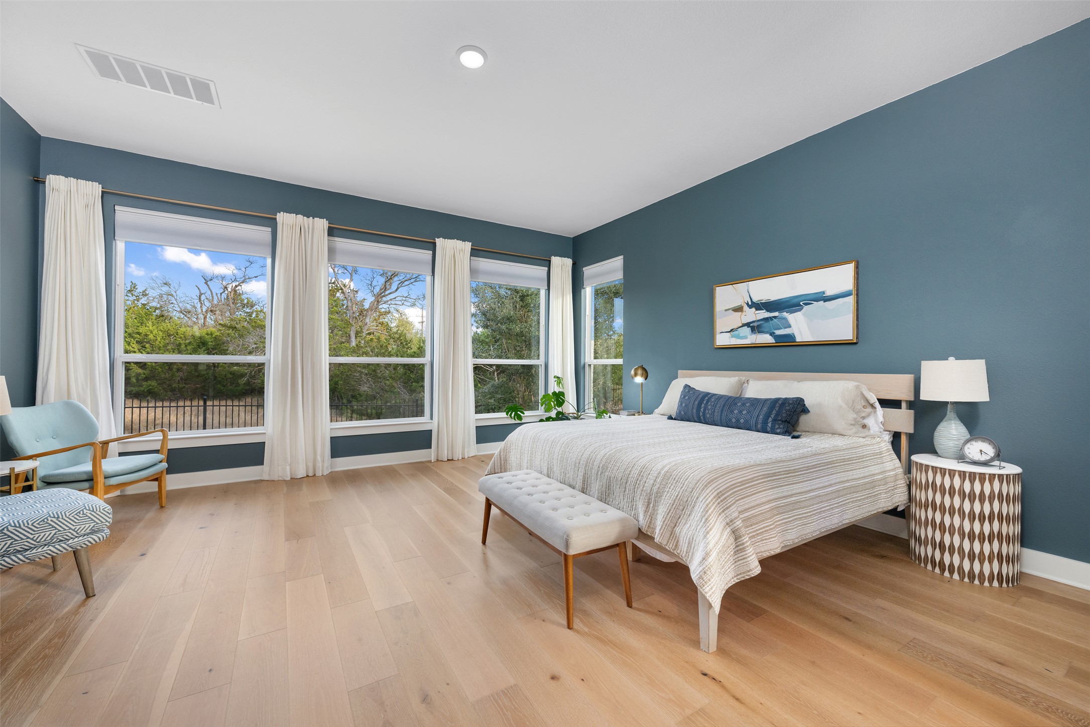 438 Pear Tree Lane Austin, TX 78737 - Photo 12 of 40 a bedroom with a large bed and a large window