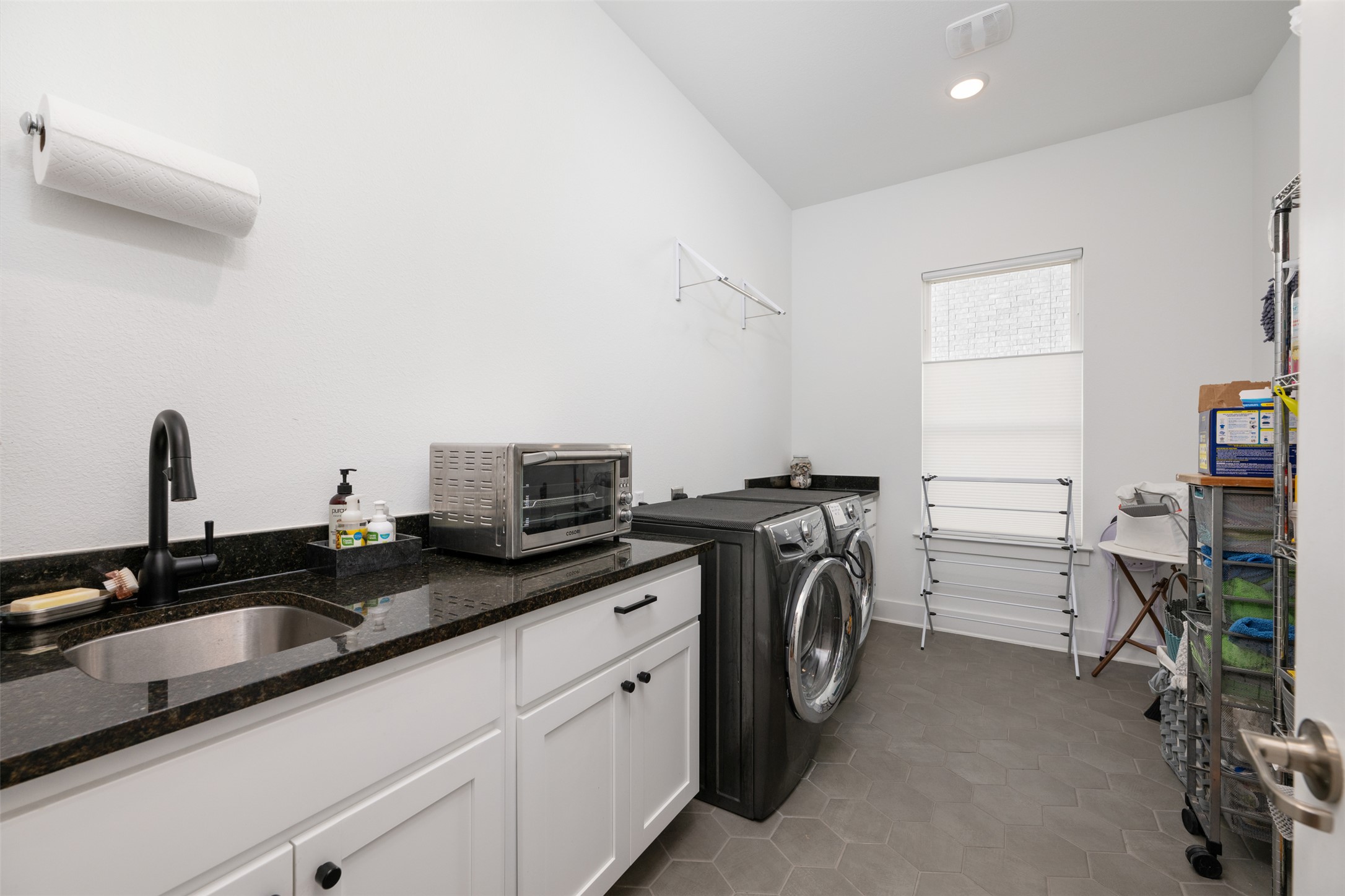 438 Pear Tree Lane Austin, TX 78737 - Photo 22 of 40 a utility room with dryer and washer