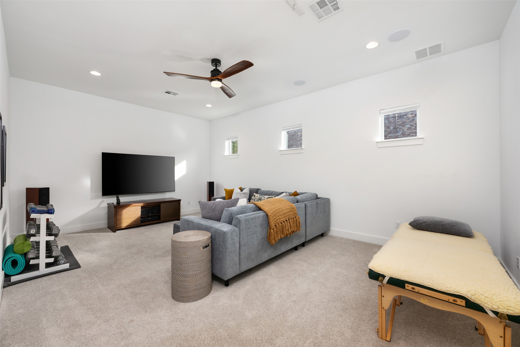 438 Pear Tree Lane Austin, TX 78737 - Photo 25 of 40 a living room with furniture and a flat screen tv
