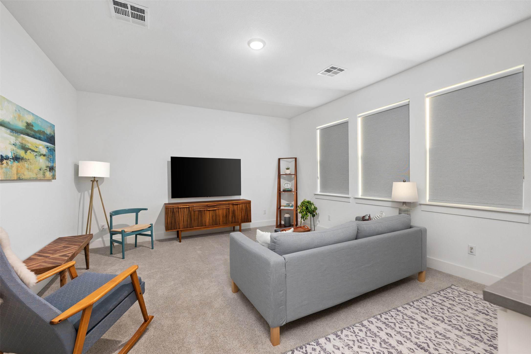 438 Pear Tree Lane Austin, TX 78737 - Photo 27 of 40 a living room with furniture and a flat screen tv