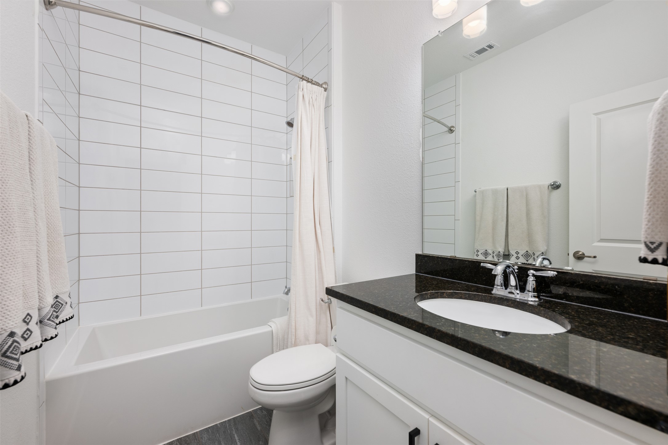 438 Pear Tree Lane Austin, TX 78737 - Photo 30 of 40 a bathroom with a granite countertop sink toilet and shower