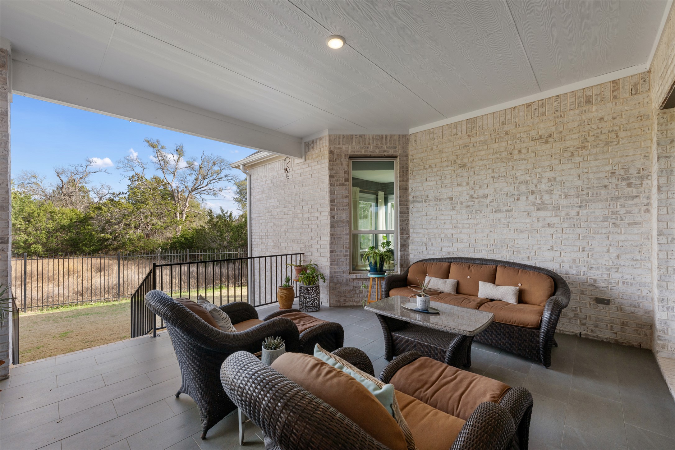 438 Pear Tree Lane Austin, TX 78737 - Photo 32 of 40 a balcony with furniture and wooden floor