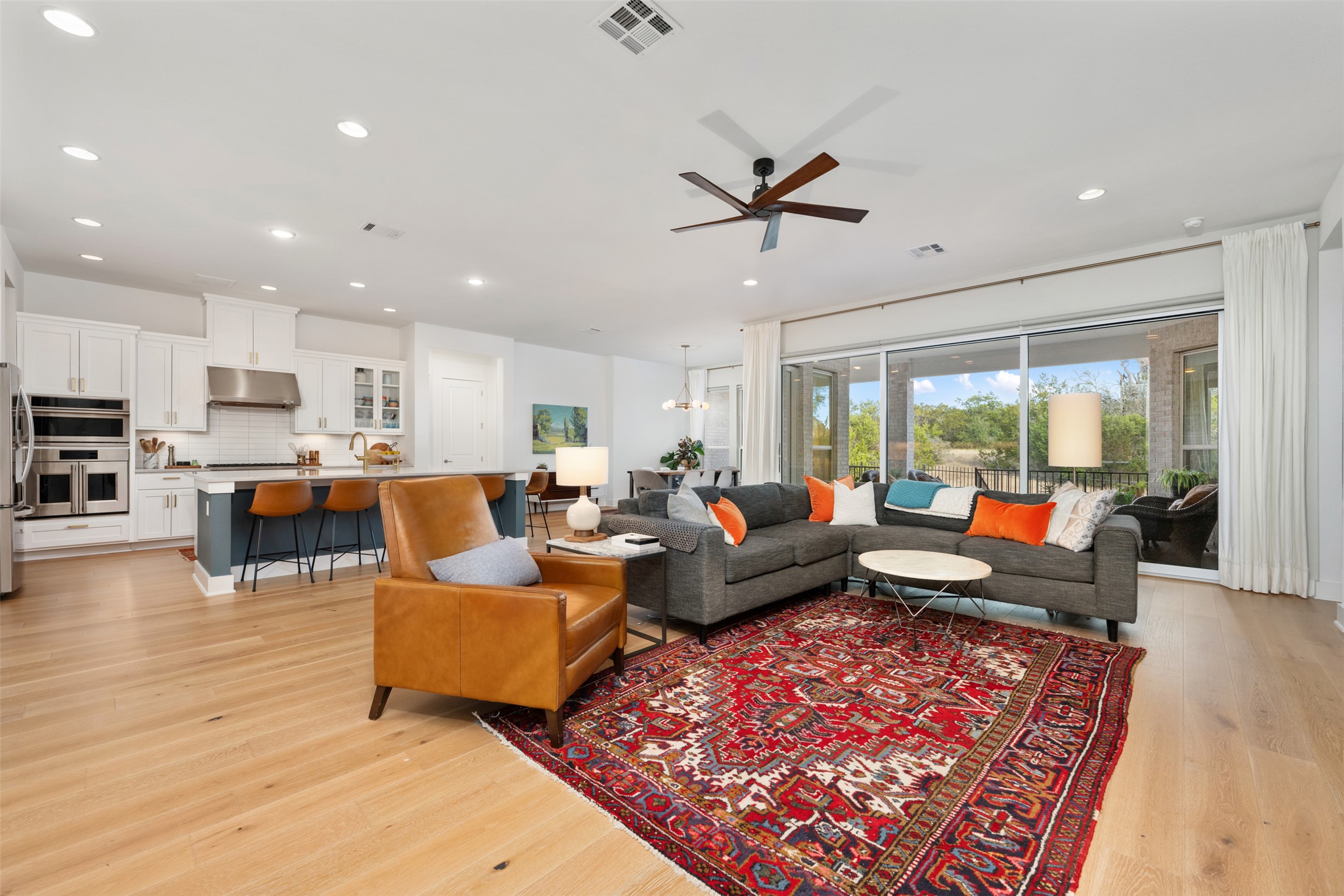 438 Pear Tree Lane Austin, TX 78737 - Photo 8 of 40 a living room with furniture and a wooden floor
