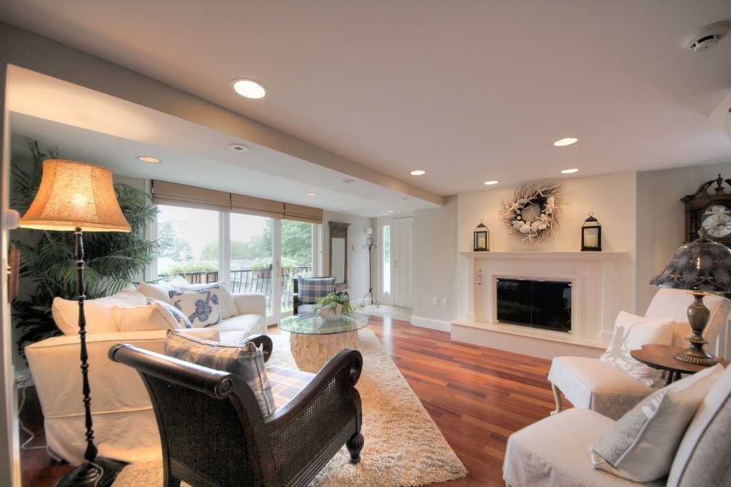 158 Evans Rd Extension Marblehead, MA 01945 - Photo 13 of 30 a living room with furniture and a fireplace