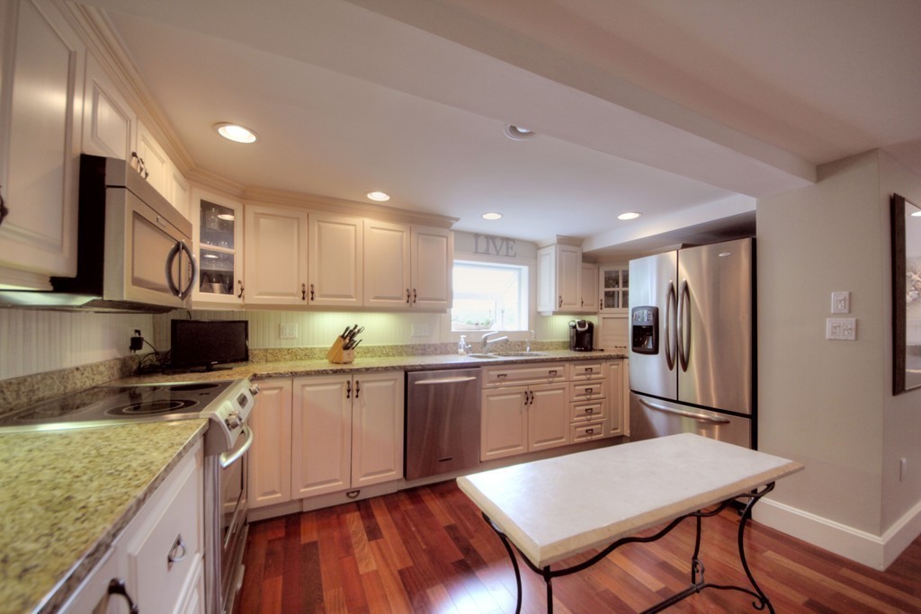158 Evans Rd Extension Marblehead, MA 01945 - Photo 17 of 30 a kitchen with a sink a counter top space stainless steel appliances and cabinets