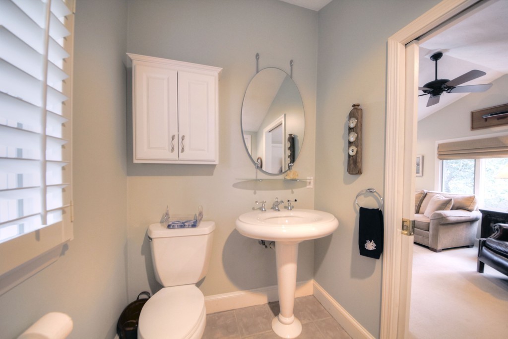 158 Evans Rd Extension Marblehead, MA 01945 - Photo 20 of 30 a bathroom with a toilet sink and mirror