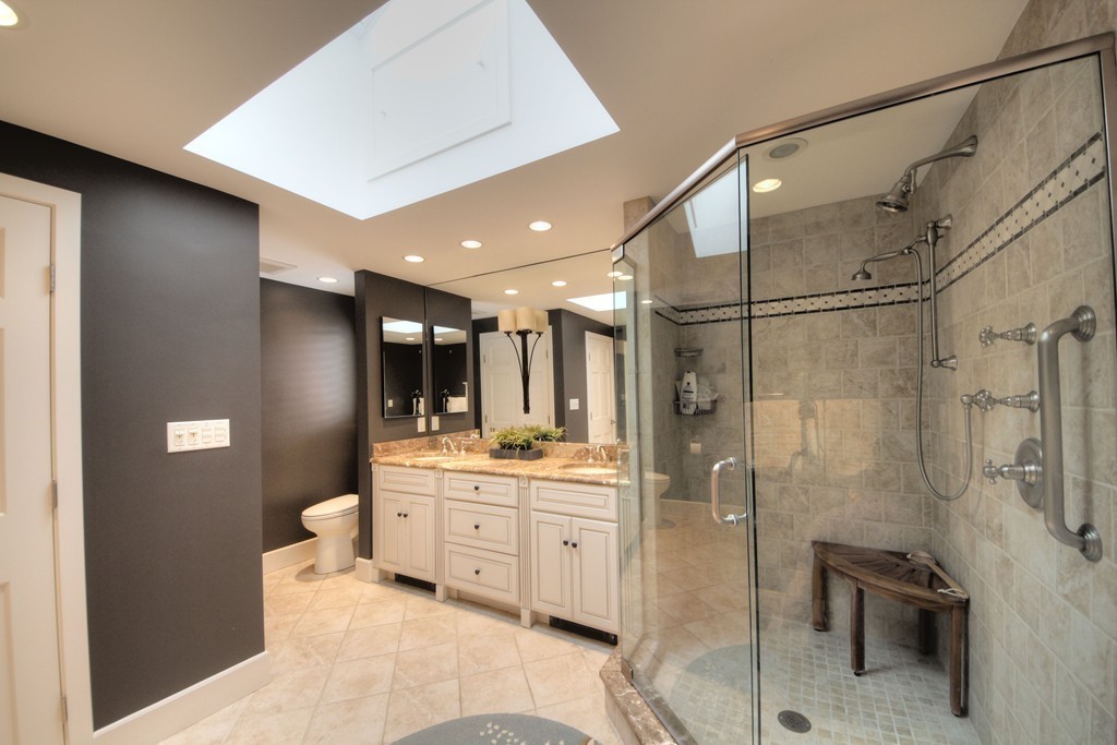 158 Evans Rd Extension Marblehead, MA 01945 - Photo 23 of 30 a bathroom with a double vanity sink toilet mirror and shower