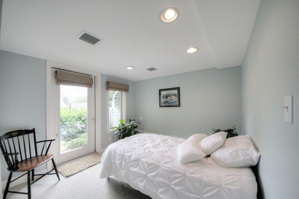 158 Evans Rd Extension Marblehead, MA 01945 - Photo 26 of 30 a bedroom with a bed and a window