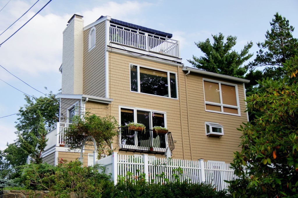 158 Evans Rd Extension Marblehead, MA 01945 - Photo 4 of 30 a view of a house with a balcony and plants