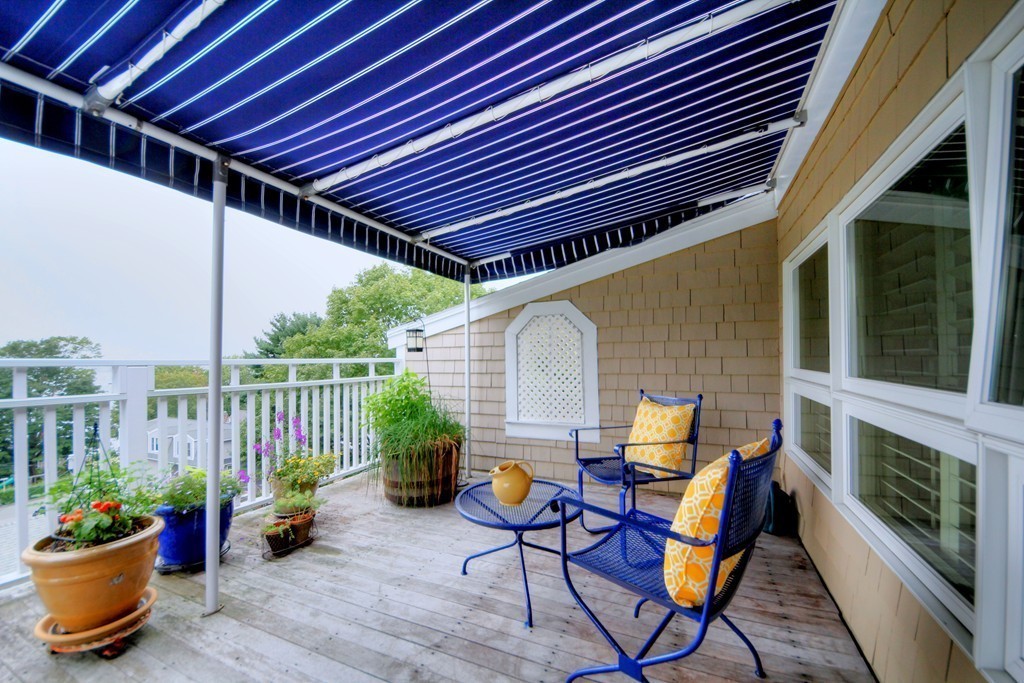 158 Evans Rd Extension Marblehead, MA 01945 - Photo 6 of 30 a patio with table and chairs and potted plants