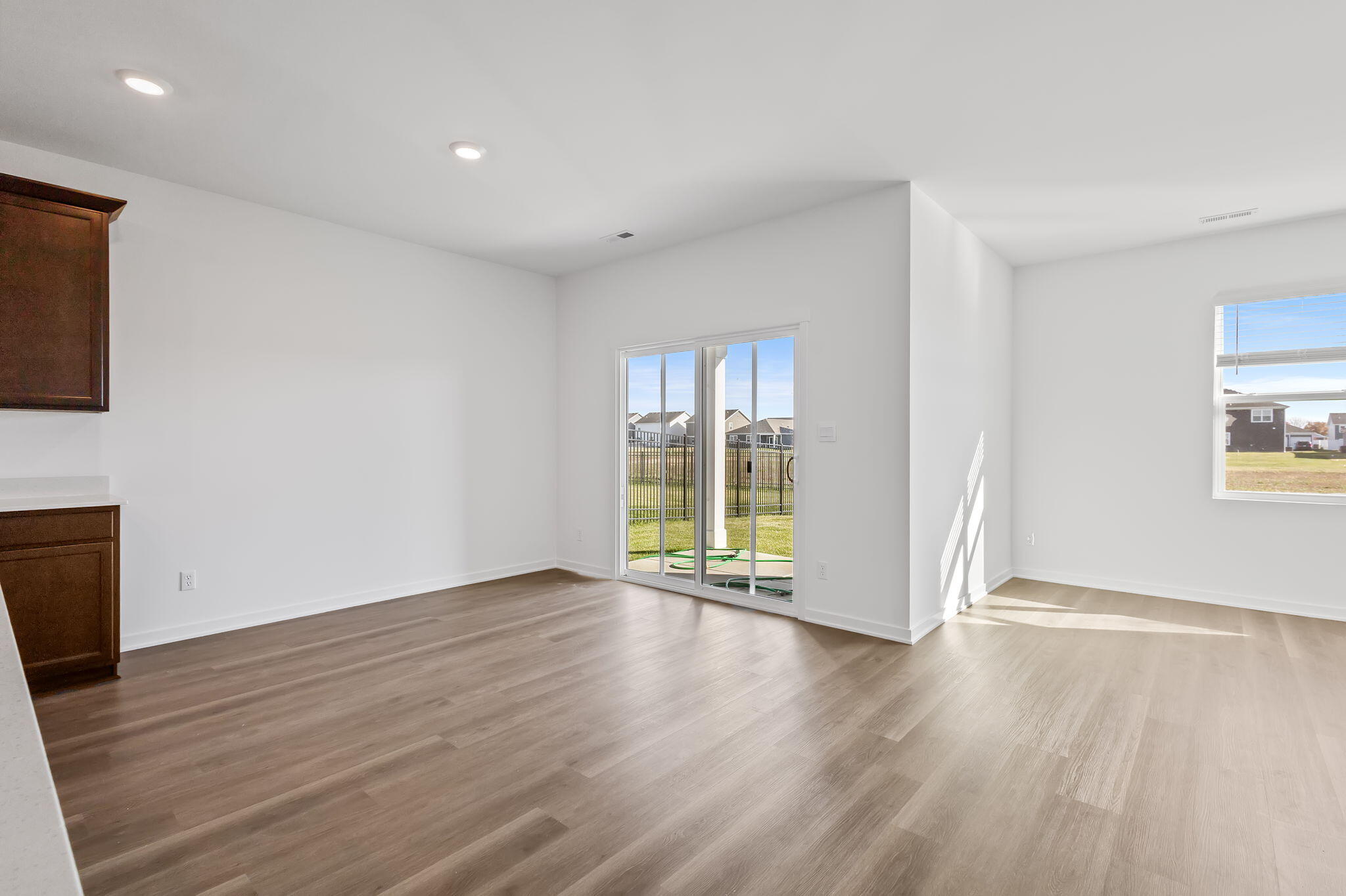 10524 Morse Place Crown Point, IN 46307 - Photo 7 of 21 a view of an empty room with wooden floor and a window