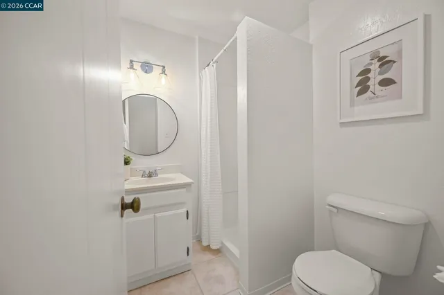 a balcony with furniture and wooden floor