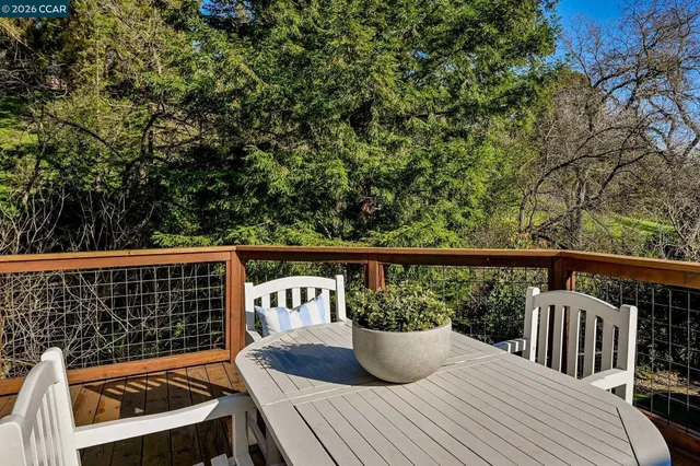 a view of a deck with couches table and chairs