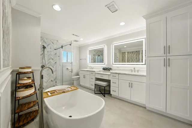a bathroom with a sink a bathtub and a window