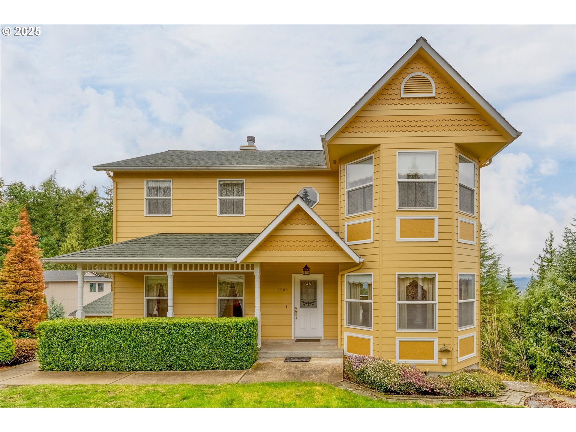 a front view of a house with yard