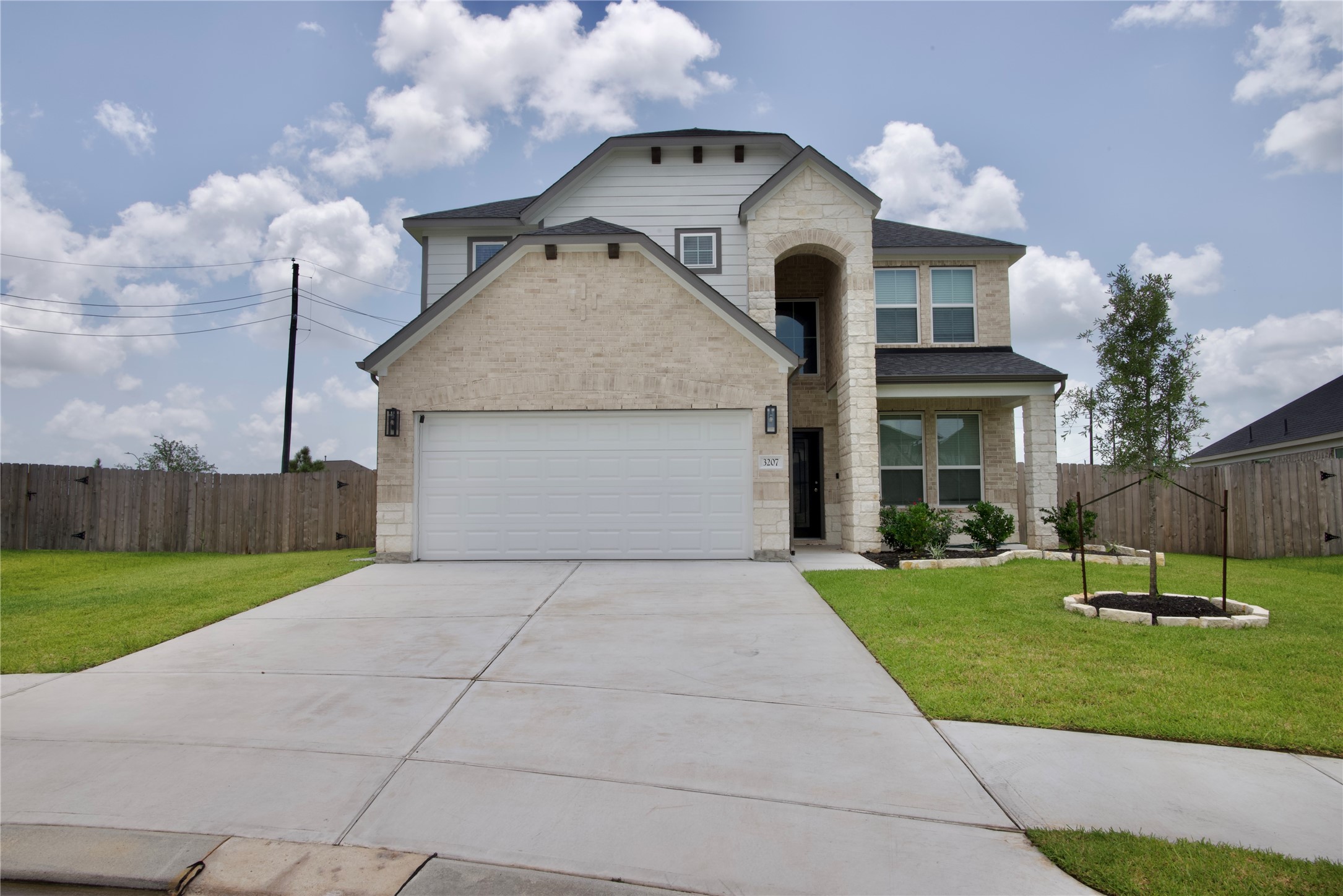 3207 Tilley Drive Rosenberg, TX 77471 - Photo 2 of 43 a front view of a house with a yard and a garage