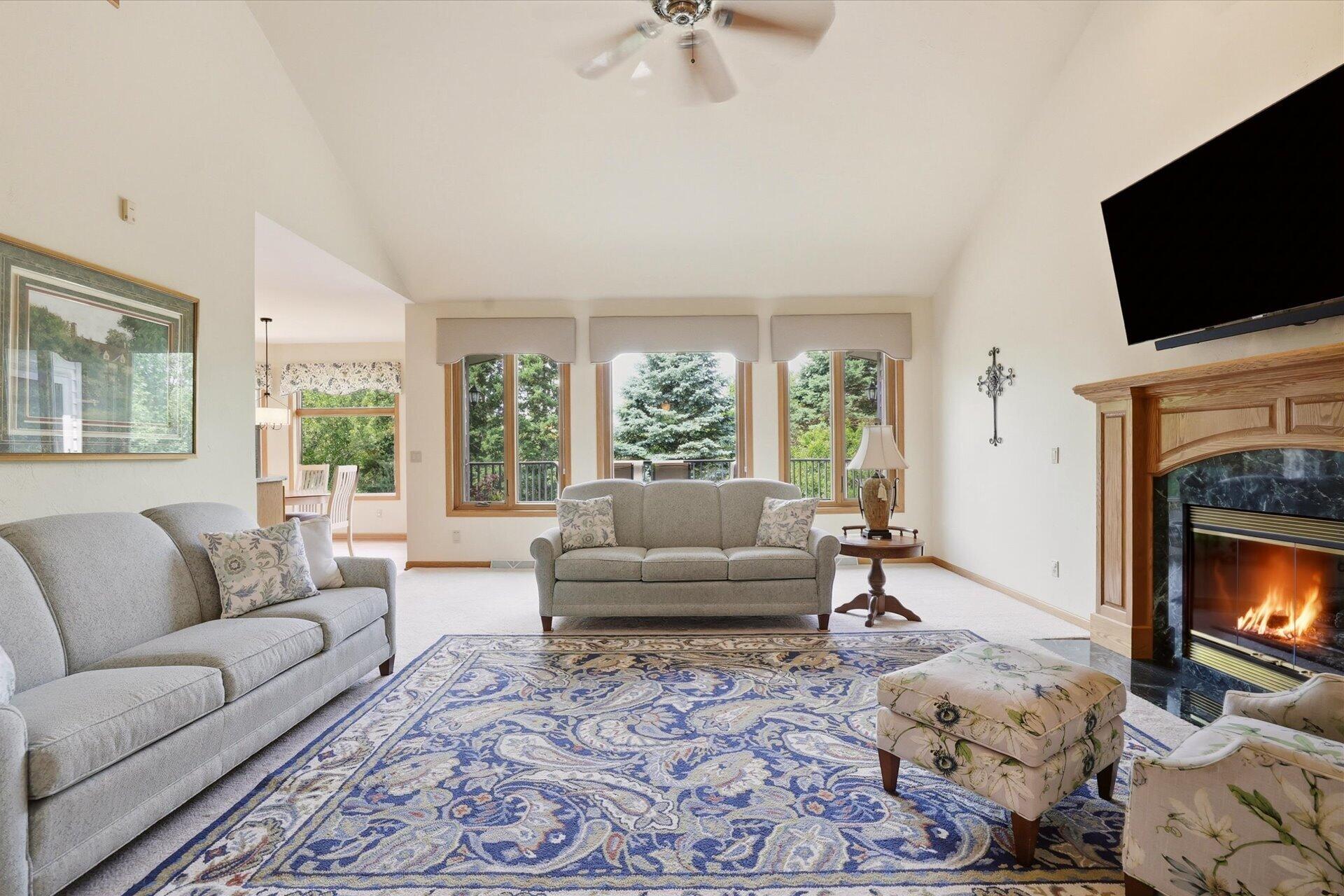 W330-s1417 County Rd C Delafield, WI 53018 - Photo 5 of 39 Great Room w/Vaulted Ceiling, Wood Beam, Gas Fireplace, & Built-Ins