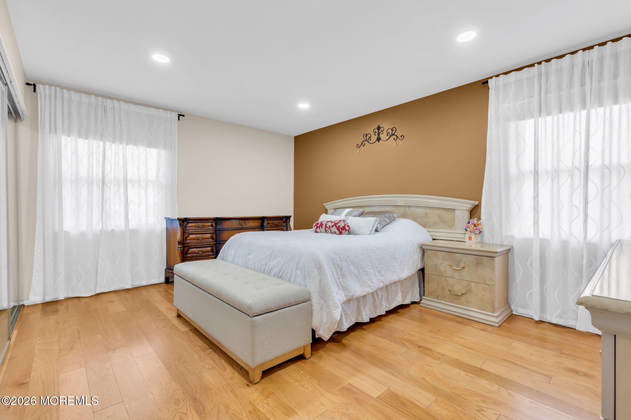 101 Andover Lane Matawan, NJ 07747 - Photo 36 of 51 a spacious bedroom with a bed and wooden floor