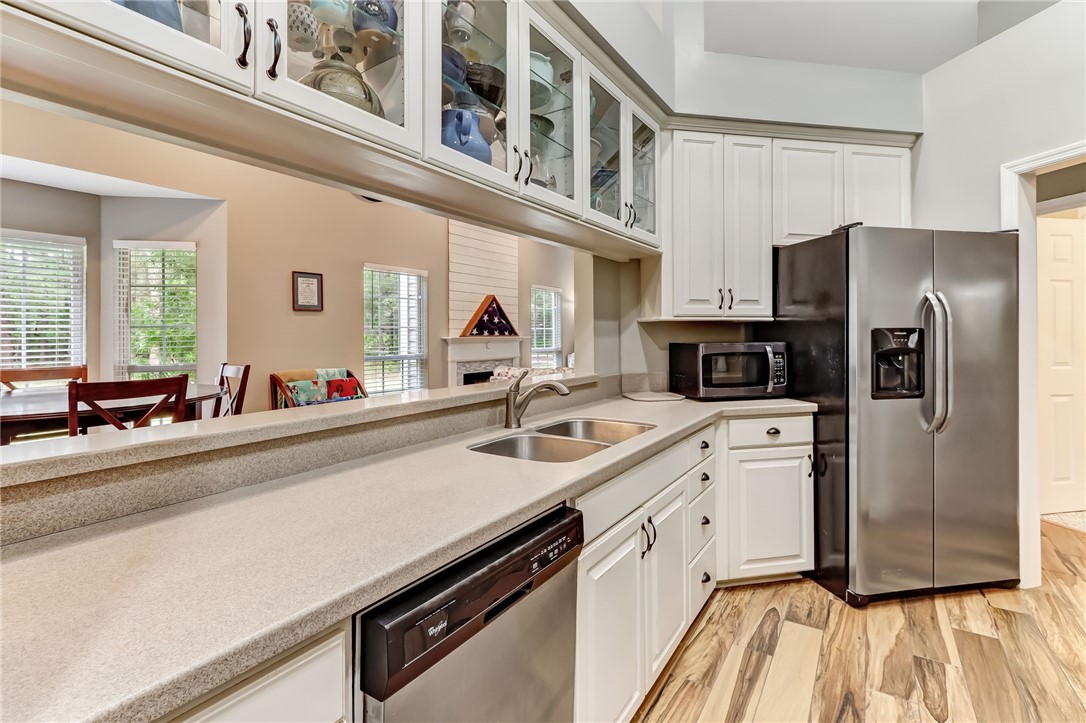96242 Lang Road Yulee, FL 32097 - Photo 15 of 32 a kitchen with stainless steel appliances a sink a stove and a refrigerator