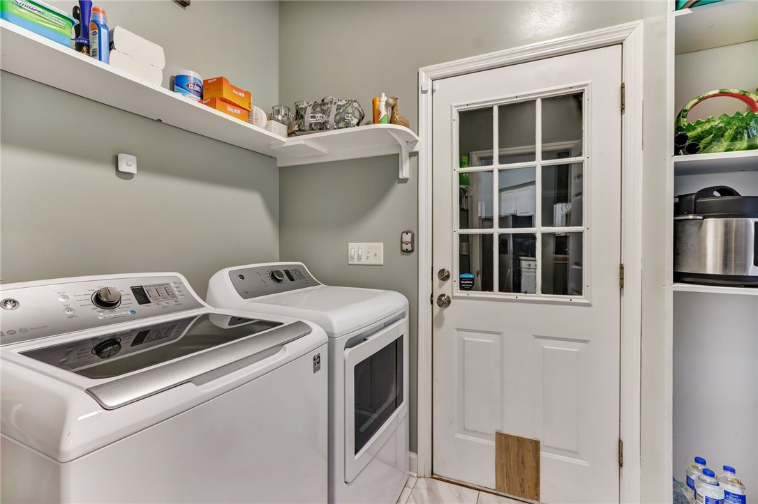 96242 Lang Road Yulee, FL 32097 - Photo 25 of 32 a utility room with dryer and washer