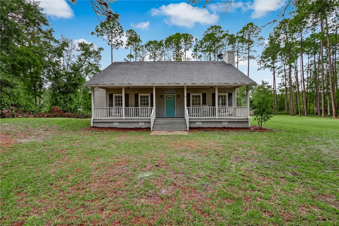 96242 Lang Road Yulee, FL 32097 - Photo 4 of 32 front view of a house with a yard