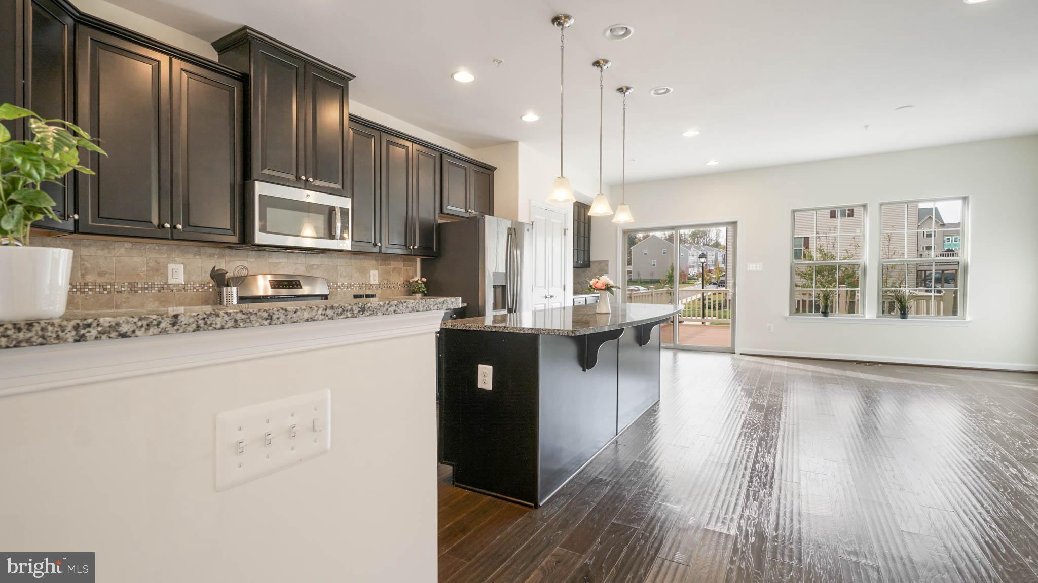 7869 Patterson Way Hanover, MD 21076 - Photo 18 of 41 Kitchen flows into large dining area
