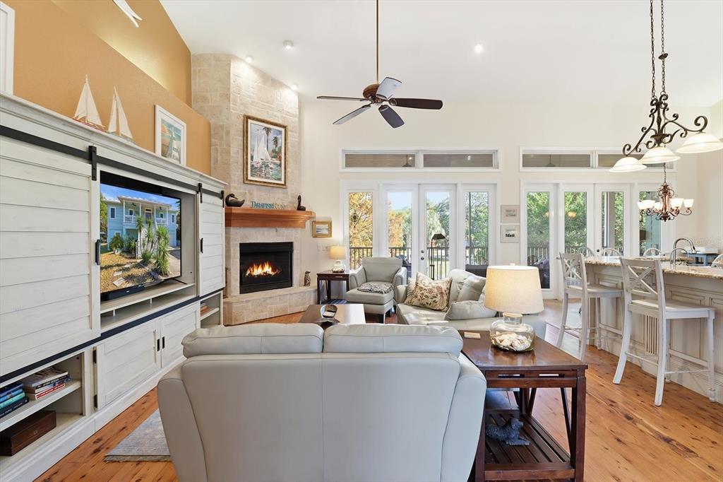 5 Palm Drive Yankeetown, FL 34498 - Photo 11 of 53 a living room with furniture a fireplace and a flat screen tv