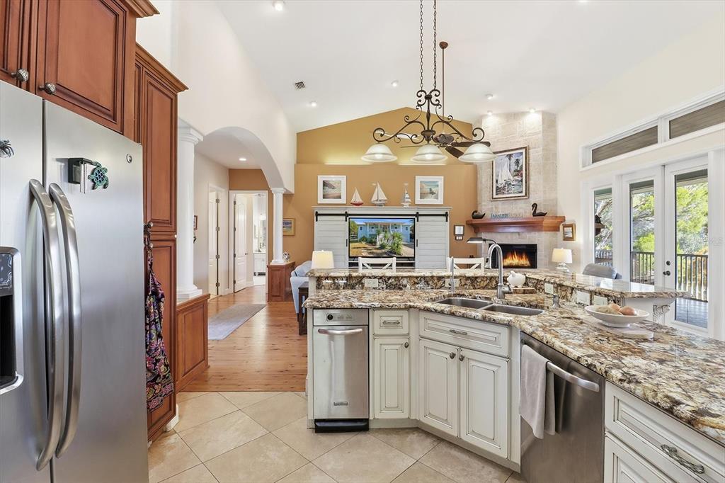 5 Palm Drive Yankeetown, FL 34498 - Photo 16 of 53 a kitchen with stainless steel appliances granite countertop a sink a stove and a refrigerator