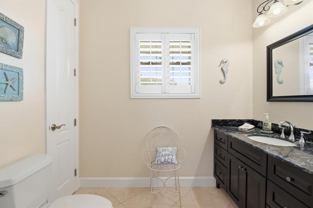 5 Palm Drive Yankeetown, FL 34498 - Photo 17 of 53 a bathroom with a granite countertop sink toilet and shower
