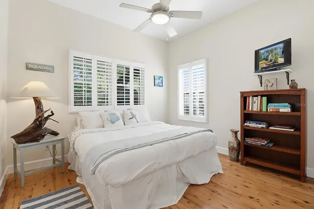 a bedroom with a bed and a lamp