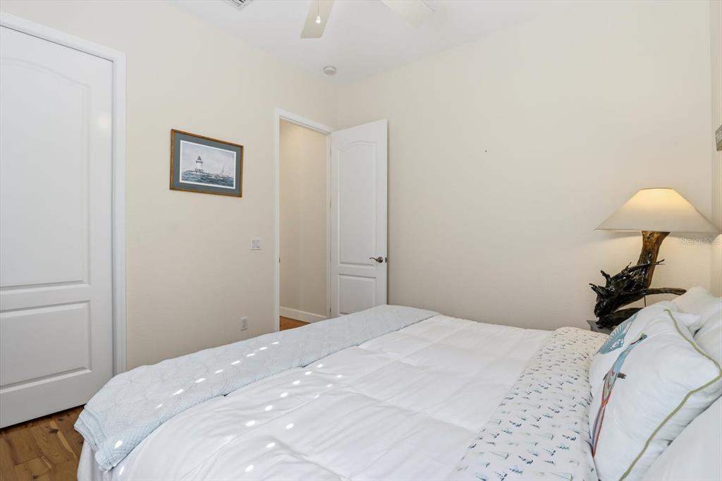 5 Palm Drive Yankeetown, FL 34498 - Photo 19 of 53 a bedroom with a bed and a lamp