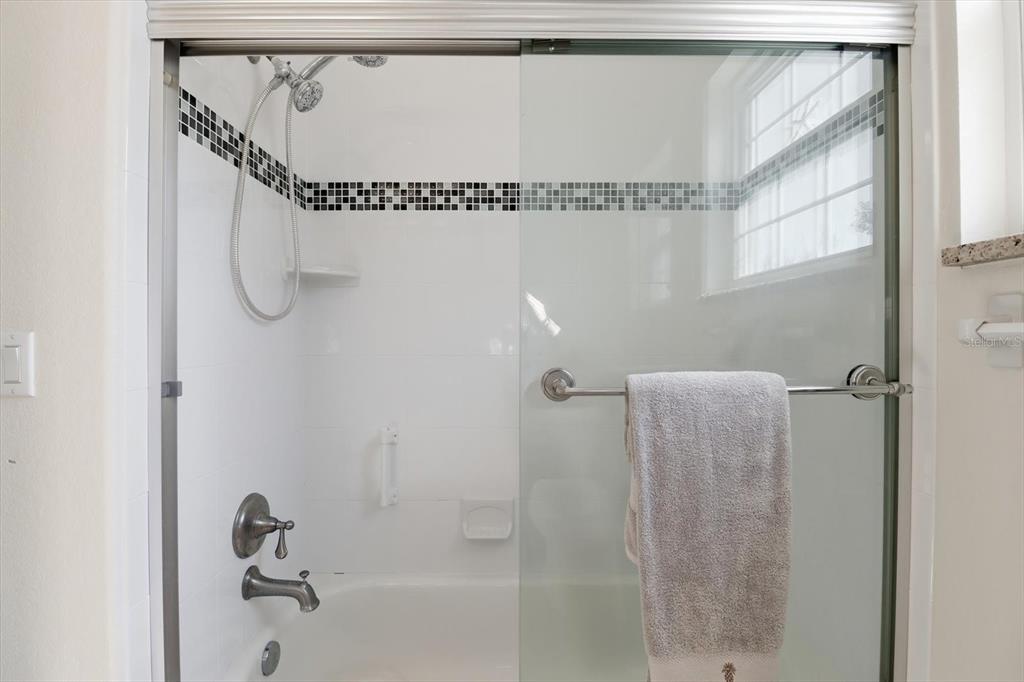 5 Palm Drive Yankeetown, FL 34498 - Photo 21 of 53 a bathroom with a shower and a bath tub