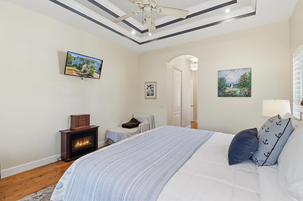 5 Palm Drive Yankeetown, FL 34498 - Photo 25 of 53 a bedroom with a bed and a lamp on a dresser