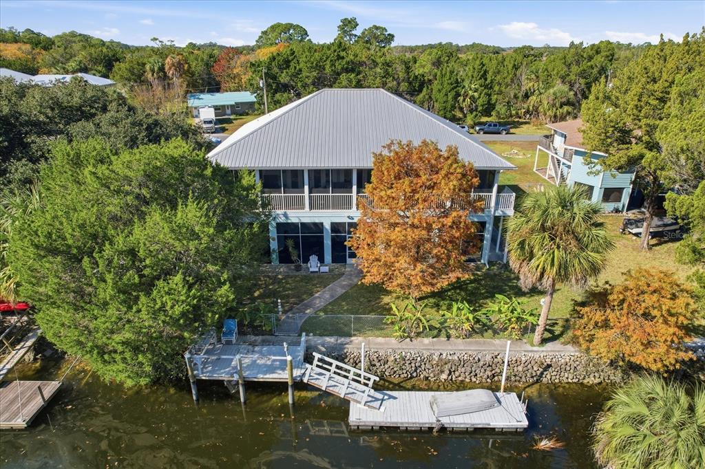 5 Palm Drive Yankeetown, FL 34498 - Photo 45 of 53 a aerial view of a house with a yard table and chairs