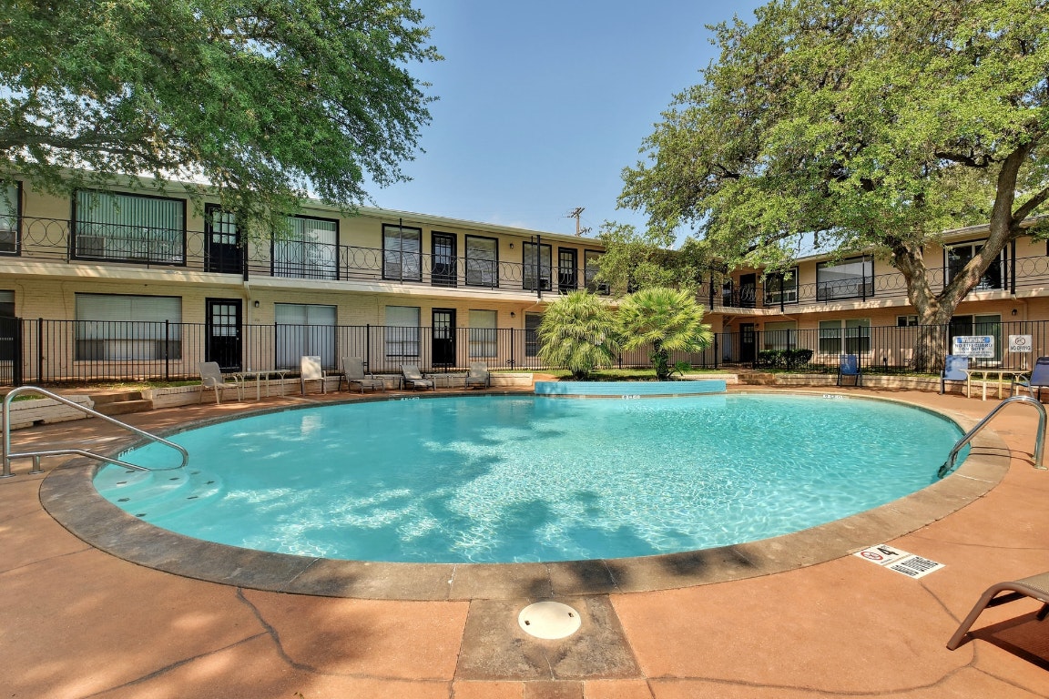 1210 Windsor Road, Unit 117 Austin, TX 78703 - Photo 11 of 17 front view of a house with a swimming pool