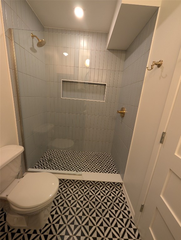 1210 Windsor Road, Unit 117 Austin, TX 78703 - Photo 14 of 17 a bathroom with a sink and a toilet