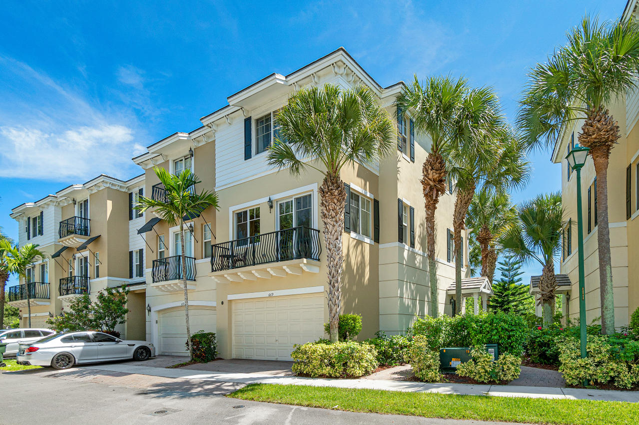 669 Northwest 38th Circle Boca Raton, FL 33431 - Photo 1 of 35 a front view of a house with garden