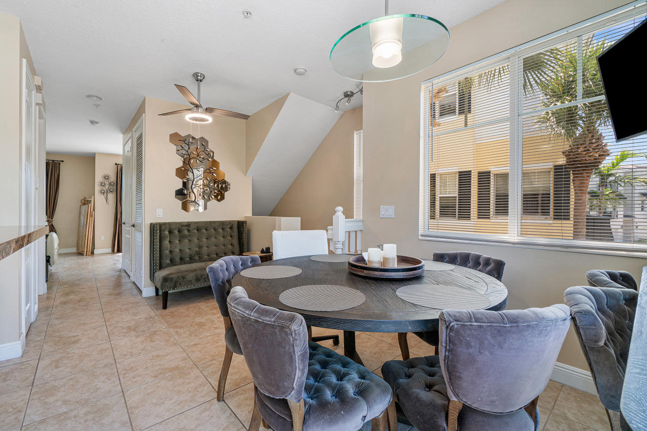669 Northwest 38th Circle Boca Raton, FL 33431 - Photo 13 of 35 a view of a dining room with furniture and a chandelier