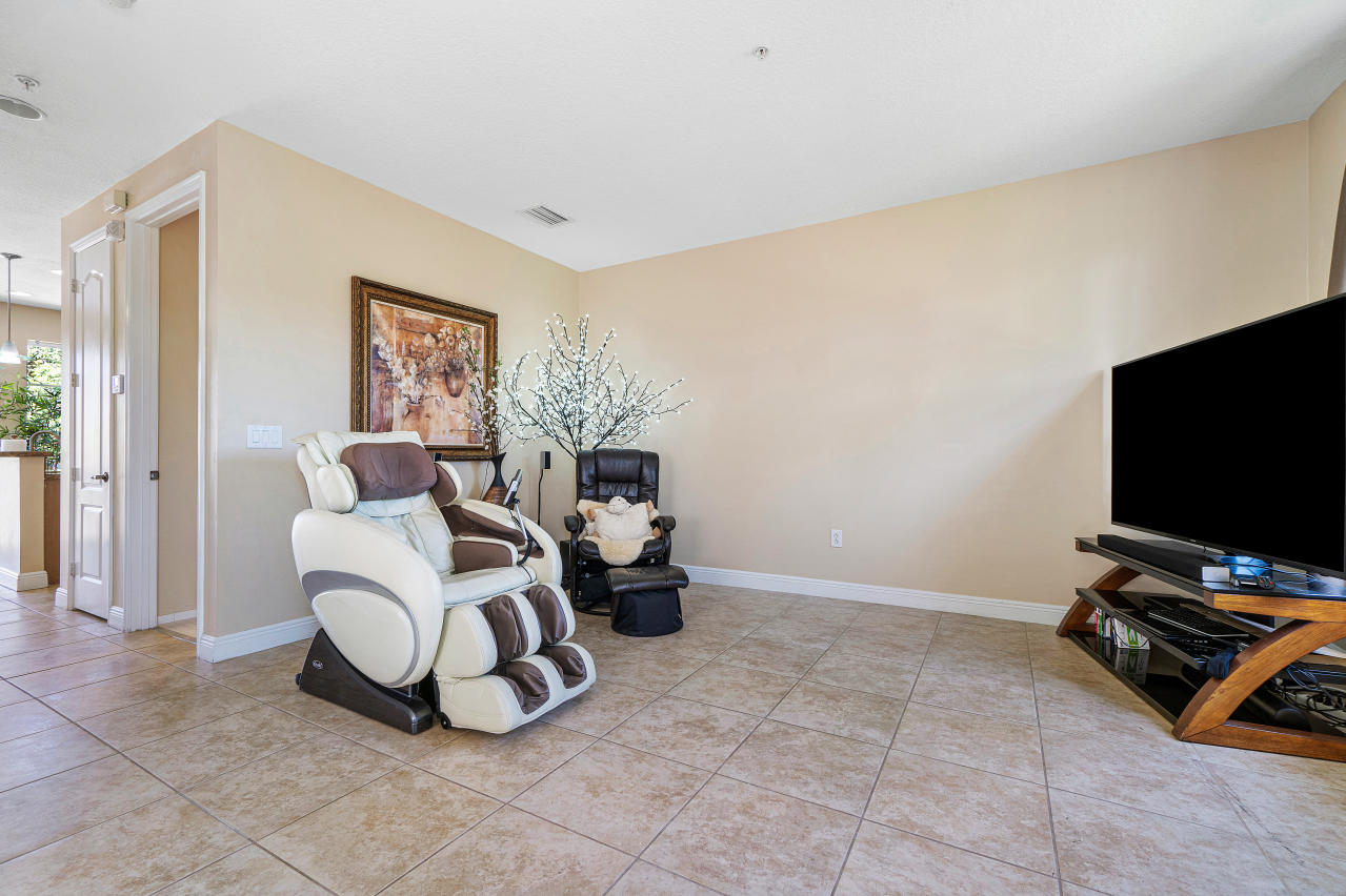 669 Northwest 38th Circle Boca Raton, FL 33431 - Photo 16 of 35 a living room with furniture and a flat screen tv