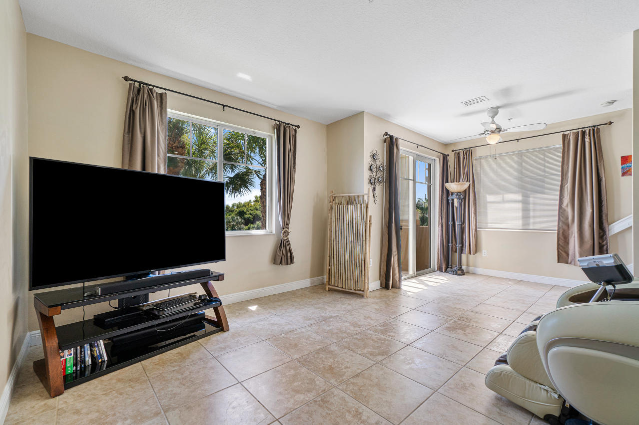 669 Northwest 38th Circle Boca Raton, FL 33431 - Photo 18 of 35 a living room with furniture and a flat screen tv